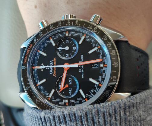 The orange elements are striking on the black dial.